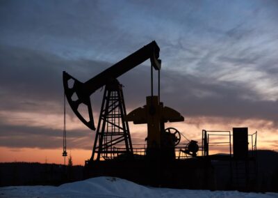 Beautiful sunset over oil field with pump jack